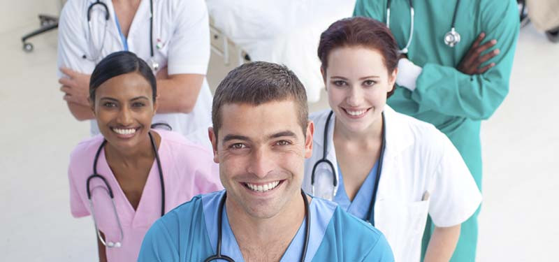 Group of Nurses Staring Up at Camera